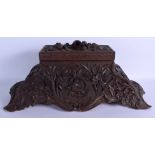 A RARE LARGE 19TH CENTURY BAVARIAN BLACK FOREST CARVED WOOD BOX decorated with foliage, armorial cre