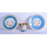 A PAIR OF LATE 19TH CENTURY FRENCH POWDER BLUE PLATES painted with putti, together with a sugar bowl
