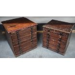 A MATCHED PAIR OF ANTIQUE WATCH CLOCK MAKERS CHESTS with several drawers, revealing spare parts etc.