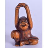 A 19TH CENTURY JAPANESE MEIJI PERIOD CARVED BOXWOOD NETSUKE modelled as a male holding his hands alo