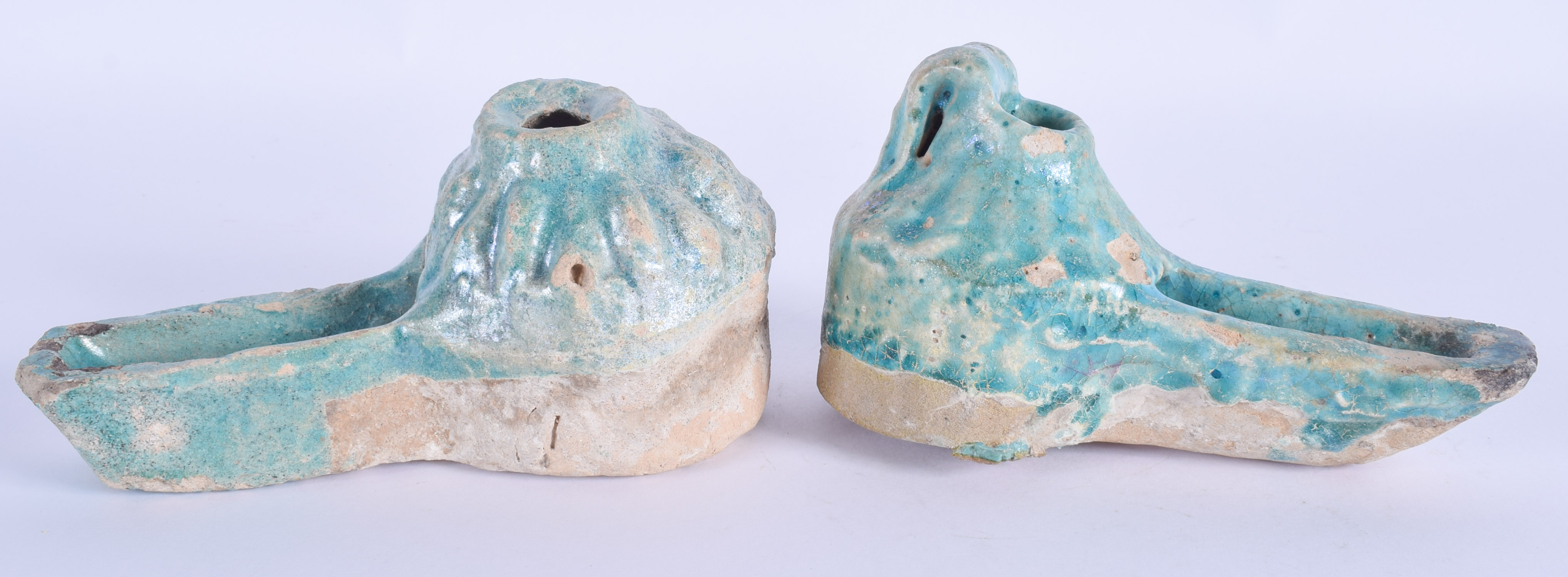 A PAIR OF 12TH/13TH CENTURY PERSIAN TURQUOISE GLAZED OIL LAMPS Iran. 14 cm x 7 cm. (2)