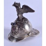 AN UNUSUAL SILVER GEM SET MILITARY HELMET with eagle terminal. 6 cm x 5 cm.