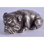 AN UNUSUAL CONTINENTAL SILVER AND RUBY MODEL OF A RECUMBENT HOUND. 6.5 cm x 3 cm.
