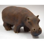 A STUDIO POTTERY STONEWARE HIPPO. 23 cm wide.