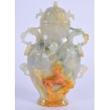 AN EARLY 20TH CENTURY CHINESE CARVED JADEITE VASE AND COVER decorated with a buddhistic lion. 12 cm