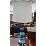 A LARGE VINTAGE BLUE POTTERY LAMP.