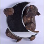 A 19TH CENTURY BAVARIAN BLACK FOREST BEAR MIRROR formed with a crescent shaped mirror. 23 cm x 20 cm