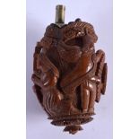AN 18TH CENTURY CARVED COQUILLA NUT SCENT BOTTLE AND STOPPER decorated with classical figures. 7 cm
