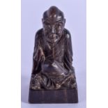 A 19TH CENTURY CHINESE CARVED RHINOCEROS HORN SEAL Qing, formed as a seated buddha. 14 grams. 4.5 cm