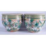 A GOOD PAIR OF 19TH CENTURY CHINESE FAMILLE VERTE FISH BOWLS Qing, painted with warriors within land