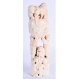 A 19TH CENTURY JAPANESE MEIJI PERIOD CARVED IVORY OKIMONO modelled with numerous apes. 18 cm x 4 cm.