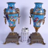 A GOOD PAIR OF 19TH CENTURY AESTHETIC MOVEMENT PORCELAIN VASES painted with birds and foliage. 34 cm