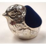 A SILVER BIRD PIN CUSHION. 4 cm wide.