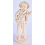 A 19TH CENTURY JAPANESE MEIJI PERIOD CARVED IVORY OKIMONO modelled as a musician. 18 cm high.