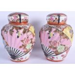 A RARE PAIR OF 19TH CENTURY JAPANESE MEIJI PERIOD KUTANI JARS AND COVERS painted with birds and foli