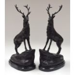 A PAIR OF BRONZE STAGS. 44 cm x 20 cm.