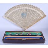 A CASED 19TH CENTURY CHINESE CARVED IVORY FAN Qing, possibly made for the European market, depicting