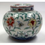 A CHINESE DOUCAI PORCELAIN JAR AND COVER. 11 cm x 11 cm.
