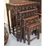 A 19TH CENTURY CHINESE CARVED HONGMU NEST OF TABLES Qing. Largest 72 cm x 51 cm. (4)