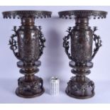 A VERY LARGE PAIR OF 19TH CENTURY JAPANESE TWIN HANDLED BRONZE VASES with naturalistic branch handle