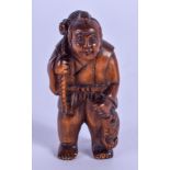 A 19TH CENTURY JAPANESE MEIJI PERIOD BOXWOOD NETSUKE modelled as a fisherman holding his catch. 4.5