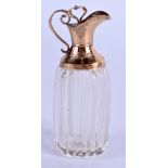 AN ANTIQUE FRENCH GOLD AND CRYSTAL GLASS SCENT BOTTLE. 8 cm high.