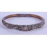 AN EARLY 20TH CENTURY CHINESE SILVER AND BAMBOO DRAGON BANGLE. 9.5 cm wide.