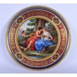 A LARGE ANTIQUE VIENNA PORCELAIN CHARGER painted with figures. 40 cm diameter.