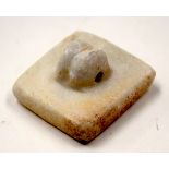 AN ASIAN STONE STAMP.