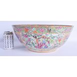 A VERY LARGE 19TH CENTURY CHINESE CANTON FAMILLE ROSE PUNCH BOWL Qing, painted with figures and inte