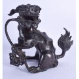 A 17TH CENTURY CHINESE BRONZE BUDDHISTIC DOG OF FOE Ming, modelled with their foot upon an open orb.