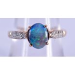 A 9CT GOLD AND OPAL RING. 2.4 grams. P/Q.