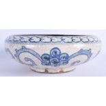 A 1940S JAPANESE BLUE AND WHITE CRACKLE GLAZED BOWL painted with dragons. 21 cm wide.