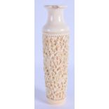 A 19TH CENTURY CHINESE CANTON IVORY VASE Qing, decorated with foliage and vines. 21 cm high.
