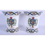 A PAIR OF 19TH CENTURY FRENCH PORCELAIN VASES painted with crests of William IV. 20.5 cm x 20 cm.