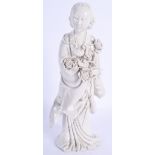 AN EARLY 20TH CENTURY CHINESE BLANC DE CHINE FIGURE OF A FEMALE modelled holding flowers. 26 cm high