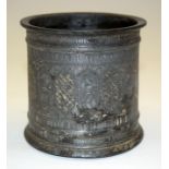 A MIDDLE EASTERN BRONZE POT. 10 cm high.