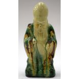 AN ANTIQUE CHINESE FIGURE. 26 cm high.