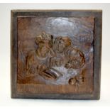 AN ANTIQUE WOODEN PANEL. 34 cm square.