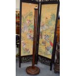 A 1930S CHINESE EXPORT CARVED HARDWOOD LAMP STAND decorated with figures. 164 cm x 40 cm.