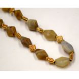 AN ASIAN STONE NECKLACE. 70 cm long.