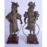 A PAIR OF 19TH CENTURY FRENCH SPELTER FIGURES OF TWO GIRLS modelled upon red marble bases. 38 cm hig