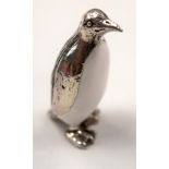 A SILVER PENGUIN. 3 cm high.