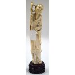 AN EARLY 20TH CENTURY CHINESE CARVED IVORY FISHERMAN modelled holding a ram. Ivory 30 cm high.