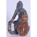 AN EARLY 20TH CENTURY CHINESE CARVED AGATE FIGURE OF A MAN modelled as a fisherman. 11 cm x 8 cm.