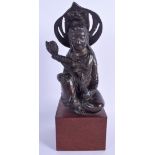 A RARE 17TH CENTURY CHINESE BRONZE FIGURE OF A BUDDHISTIC DEITY modelled holding a floral sprig. Bro