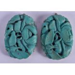 A PAIR OF 19TH CENTURY CARVED TURQUOISE PENDANTS Qing. 2.5 cm x 3.25 cm.