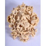 A 19TH CENTURY BAVARIAN BLACK FOREST CARVED IVORY BROOCH depicting Saint George slaying the dragon.