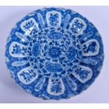 A 17TH CENTURY CHINESE BLUE AND WHITE PLATE Kangxi, painted with flowers. 21 cm wide.