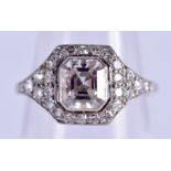 A FINE ART DECO PLATINUM AND DIAMOND SQUARE FORM RING the central square form diamond encrusted with